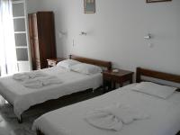 Postel nebo postele na pokoji v ubytování Bizas Rooms & Studios
