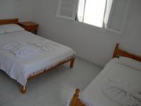 Postel nebo postele na pokoji v ubytování Bizas Rooms & Studios