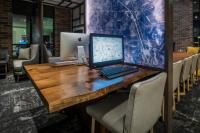 a desk with a laptop computer on top of it at Hyatt Place Boise/Downtown in Boise