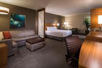 a hotel room with a bed and a couch at Hyatt Place Boise/Downtown in Boise