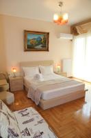 A bed or beds in a room at Olga's Studio