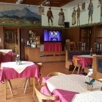 Telewizja i/lub zestaw kina domowego w obiekcie Pension Hüttwirt