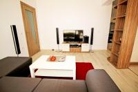 TV a/nebo společenská místnost v ubytování Lilly Apartments