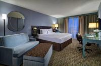 a hotel room with a bed and a desk at Crowne Plaza Chicago O'Hare Hotel & Conference Center by IHG in Rosemont