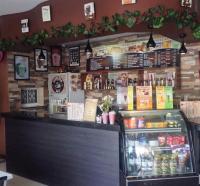 a food counter in a restaurant with a food cart at Prism Hotel in Angeles