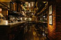 a bar with a row of bar stools at Rosa Malacca in Melaka