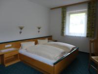 A bed or beds in a room at Ferienhaus Regina