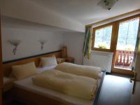 A bed or beds in a room at Ferienhaus Regina
