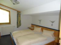 A bed or beds in a room at Ferienhaus Regina