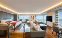 a hotel room with a bed and a living room at The Prince Gallery Tokyo Kioicho, a Luxury Collection Hotel in Tokyo