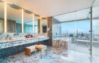 a bathroom with two sinks and a tub and a window at The Prince Gallery Tokyo Kioicho, a Luxury Collection Hotel in Tokyo