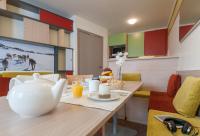 a dining room with a table with a tea pot on it at Résidence Pierre &amp; Vacances Electra in Avoriaz