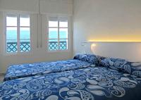 A bed or beds in a room at Fuentes de Nerja
