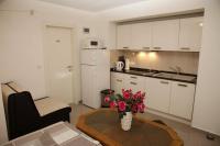 Kuchyň nebo kuchyňský kout v ubytování Apartments Šimić