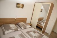 Postel nebo postele na pokoji v ubytování Apartments Šimić