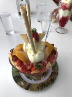 a fruit salad in a bowl on a table at Hotel Sol Puntarenas in Puntarenas