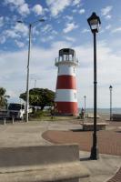 a lighthouse with a red and white stripe on it at Hotel Sol Puntarenas in Puntarenas