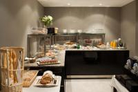 a buffet line with bread and pastries on it at Saint Georges Hotel &amp; Spa in Chalon-sur-Saône