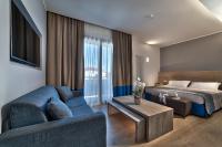 Łóżko lub łóżka w pokoju w obiekcie Hotel Petrarca Terme