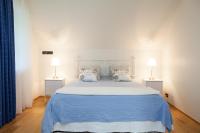 Postel nebo postele na pokoji v ubytování Toila Valgevilla Apartments
