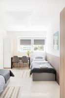 Sport Rooms II Chodakowska Warszawaにあるベッド