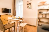 Televízia a/alebo spoločenská miestnosť v ubytovaní BpR Paulay Cozy Apartment
