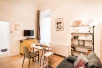 Televízia a/alebo spoločenská miestnosť v ubytovaní BpR Paulay Cozy Apartment