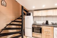 Kuchyňa alebo kuchynka v ubytovaní BpR Paulay Cozy Apartment