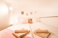 Posteľ alebo postele v izbe v ubytovaní BpR Paulay Cozy Apartment