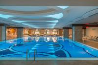 a large indoor swimming pool in a hotel room at Royal Holiday Palace in Lara