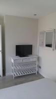 A television and/or entertainment centre at Cabo Mar Duplex