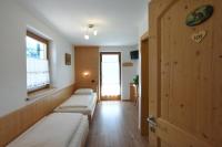 Łóżko lub łóżka w pokoju w obiekcie Agritur Maso Chemela