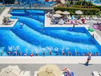 a group of people swimming in a pool at a resort at Royal Holiday Palace in Lara