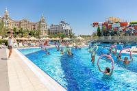 a group of people in a pool at a resort at Royal Holiday Palace in Lara