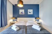 Łóżko lub łóżka w pokoju w obiekcie Gdansk Comfort Apartments Bursztynowa