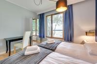 Łóżko lub łóżka w pokoju w obiekcie Gdansk Comfort Apartments Bursztynowa