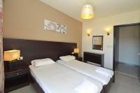 Posteľ alebo postele v izbe v ubytovaní Ialysos City Hotel