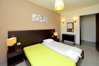 Posteľ alebo postele v izbe v ubytovaní Ialysos City Hotel