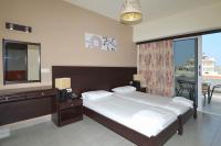 Posteľ alebo postele v izbe v ubytovaní Ialysos City Hotel