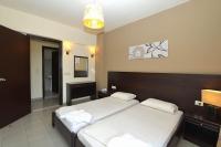Posteľ alebo postele v izbe v ubytovaní Ialysos City Hotel