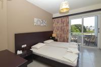 Posteľ alebo postele v izbe v ubytovaní Ialysos City Hotel