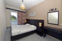 Posteľ alebo postele v izbe v ubytovaní Ialysos City Hotel
