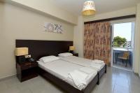 Posteľ alebo postele v izbe v ubytovaní Ialysos City Hotel