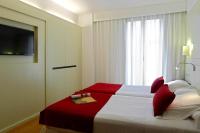 Postel nebo postele na pokoji v ubytování Grupotel Gravina