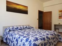 Posteľ alebo postele v izbe v ubytovaní Vittori Apartment