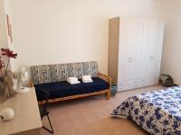 Posteľ alebo postele v izbe v ubytovaní Vittori Apartment