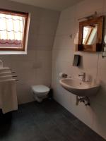 a bathroom with a sink and a toilet at Stad &amp; Strandhotel Elisabeth in Vlissingen