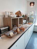 a kitchen with baskets of bread on a counter at Stad &amp; Strandhotel Elisabeth in Vlissingen
