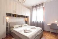 Posteľ alebo postele v izbe v ubytovaní Bilocale centro Biella