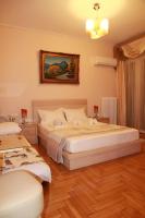 A bed or beds in a room at Olga's Studio